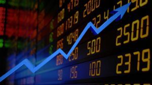 Imagem de seta ascendente na cor azul, sobreposta a um fundo preto com números em alusão às ações na Bolsa de Valores