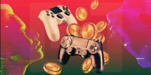 Imagem de controle de video game com moeda digitais que representam os criptoativos em alusão a modalidade de jogo em que se joga para ganhar