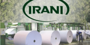 Imagem do logotipo da empresa Irani abaixo de rolos de papel