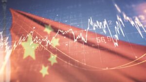 Imagem de gráficos sobrepostos à bandeira da China em alusão ao comportamento do mercado financeiro no que se refere a esse país