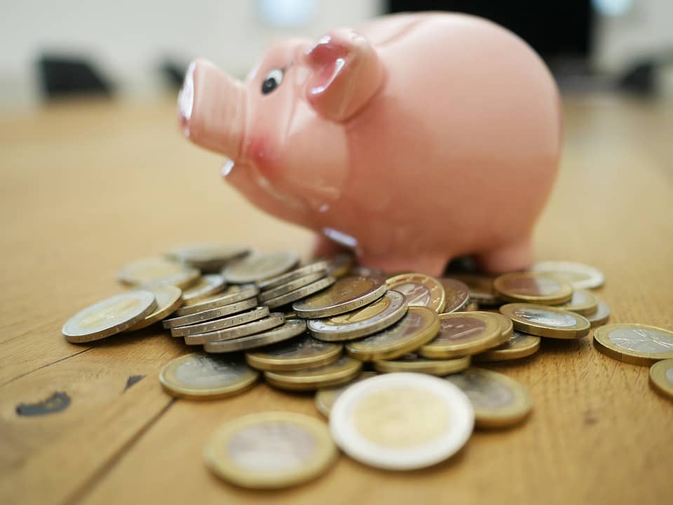 Imagem representando o VGBL, mostrando um porquinho com moedas